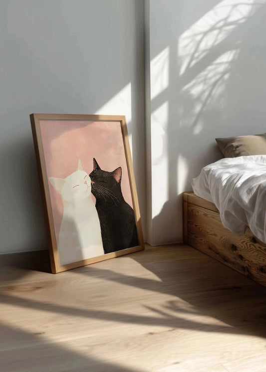 Cuadro ​Gato blanco y gato negro acariciandose
